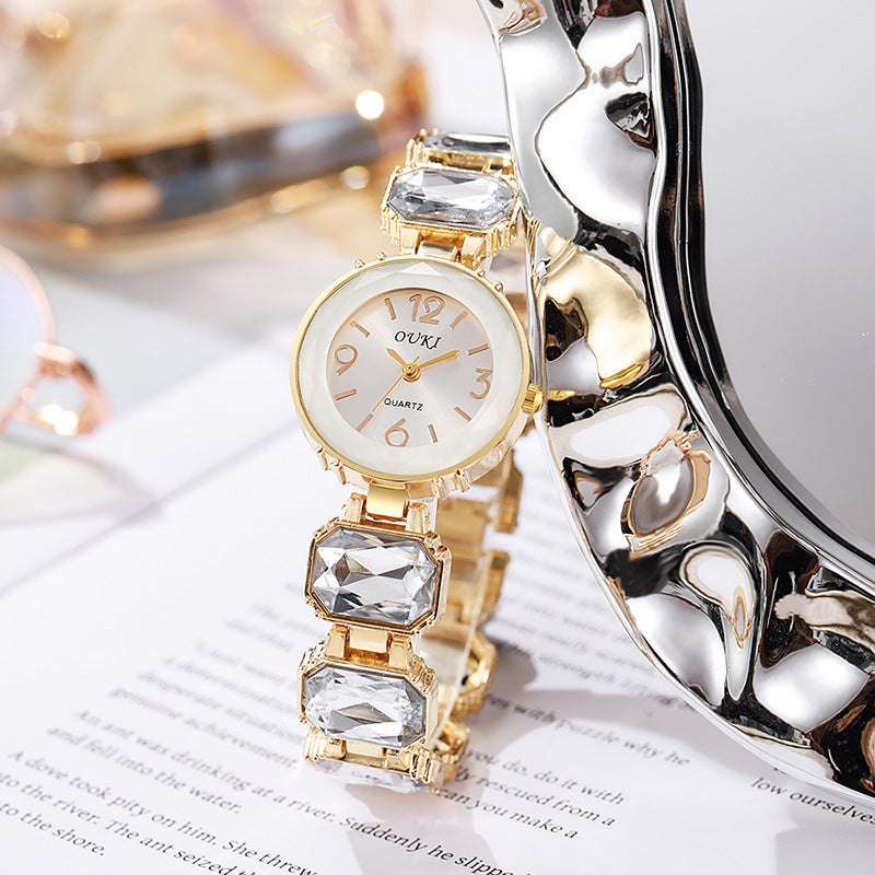 Women’s Gold Bracelet Quartz Watch with Black Crystal Dial